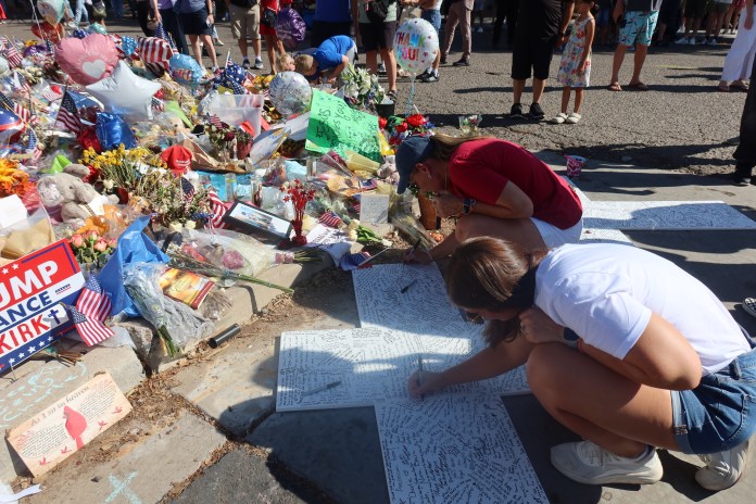 Mourners sign a tribute to Charlie Kirk outside of the Turning Point USA headquarters in Phoenix. (Samantha-Jo Roth, Washington Examiner)