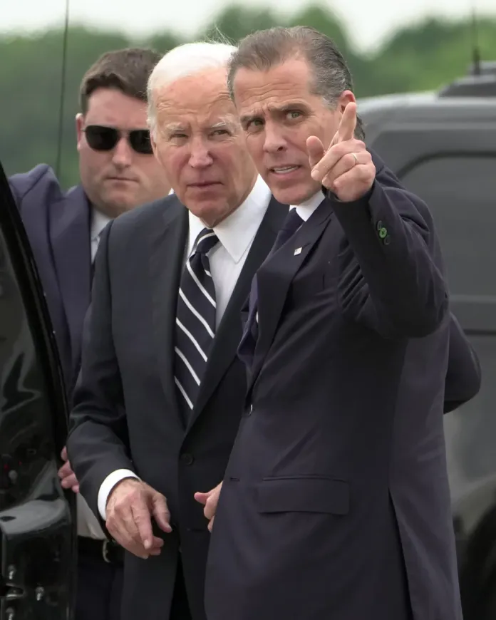 President Joe Biden talks with his son Hunter Biden.