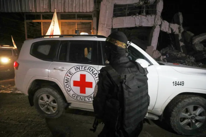 Red Cross vehicles carrying the bodies of four dead Israeli hostages depart from Gaza to Israel.