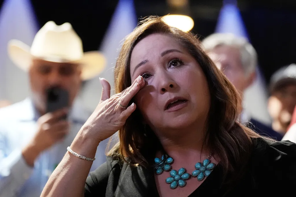 Arizona Democratic candidate Adelita Grijalva gets emotional as her children talk about her onstage after being declared the winner against Republican Daniel Butierez to fill the 7th Congressional District seat held by the late Rep. Raúl Grijalva in a special election Tuesday, Sept. 23, 2025, in Tucson, Arizona.