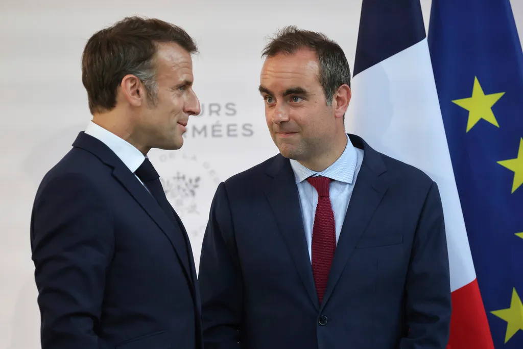 Then French defense minister, Sebastien Lecornu, right, and France's President Emmanuel Macron talk at the end of an address by the president to army leaders in Paris, Sunday, July 13, 2025, (Ludovic Marin, Pool via AP, File)