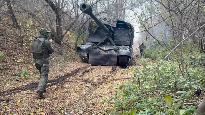 A Russian self-propelled howitzer rolls to fire toward Ukrainian positions at an undisclosed location in Ukraine.