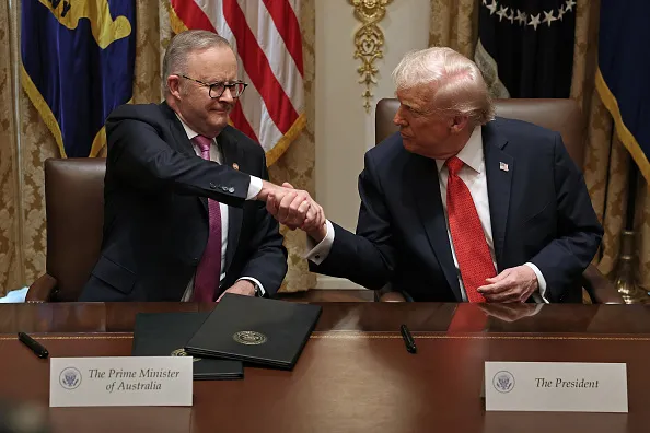 Prime Minister of Australia Anthony Albanese (L) and U.S. President Donald Trump shake hands after signing a $8.5 billion rare earth minerals agreement during a bilateral meeting in the Cabinet Room of the White House on October 20, 2025 in Washington, DC. Albanese is visiting the U.S. Capital to meet with President Trump and later visit the Pentagon.