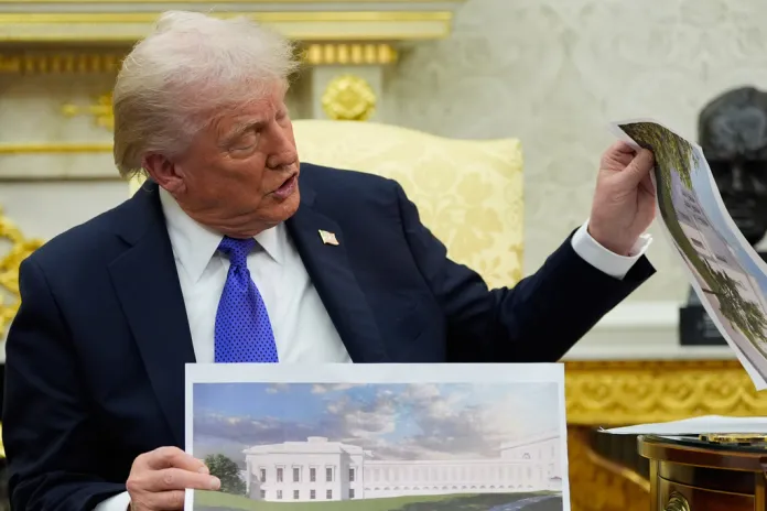 President Donald Trump holds artist renderings of the new White House ballroom