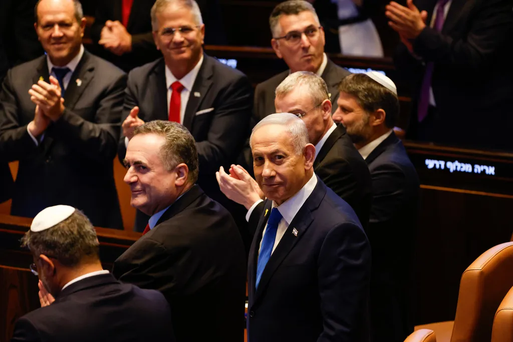 Israeli Prime Minister Benjamin Netanyahu looks on as President Donald Trump addresses the Knesset.