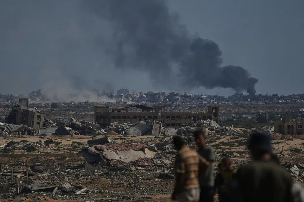 Smoke rises to the sky following an Israeli military strike in Gaza City, as seen from the central Gaza Strip, Thursday, Oct. 2, 2025.