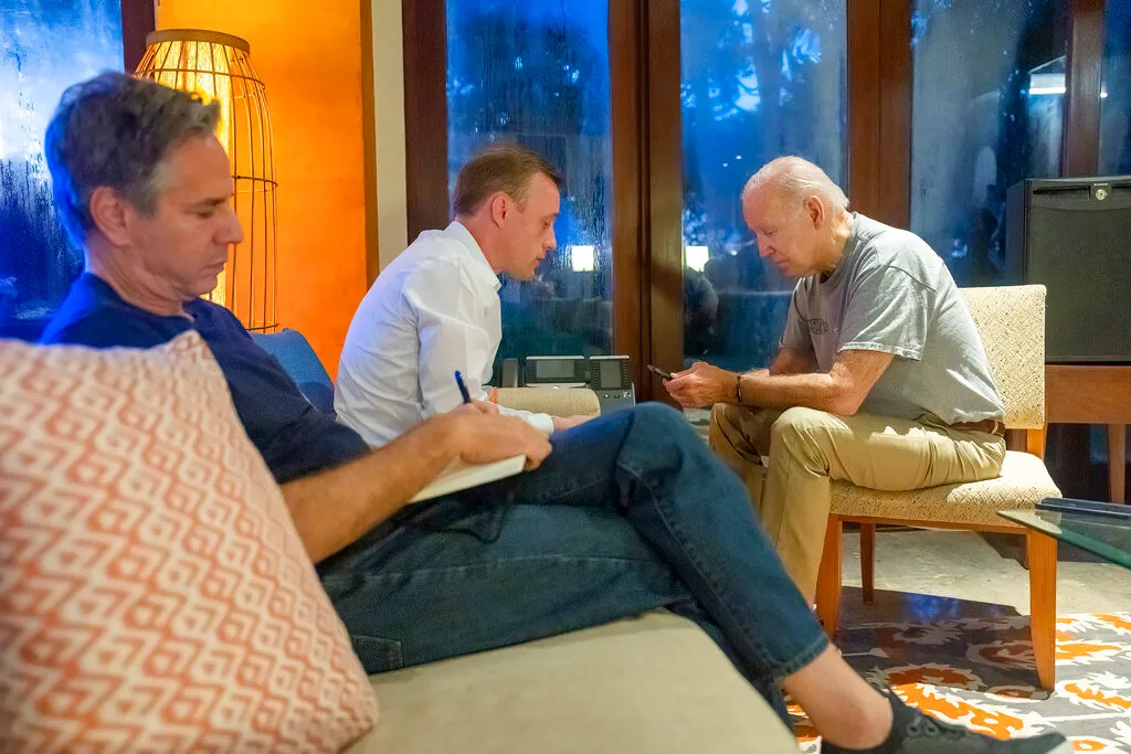 Former President Joe Biden talks on the phone with Polish President Andrzej Duda as White House national security adviser Jake Sullivan, center, and Secretary of State Antony Blinken listen, Wednesday, Nov. 16, 2022, in Nusa Dua, Indonesia. (Adam Schultz/The White House via AP)