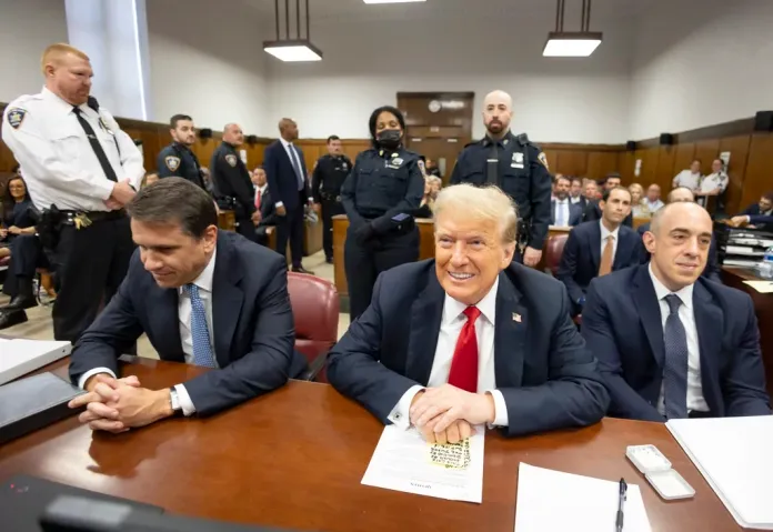 Flanked by his attorneys Todd Blanche, left, and Emil Bove, former President Donald Trump awaits the start of proceedings in Manhattan Criminal Court, Tuesday, May 28, 2024, in New York. (Justin Lane/Pool Photo via AP)