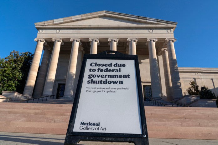 A sign that reads "Closed due to federal government shutdown" outside the National Gallery of Art.