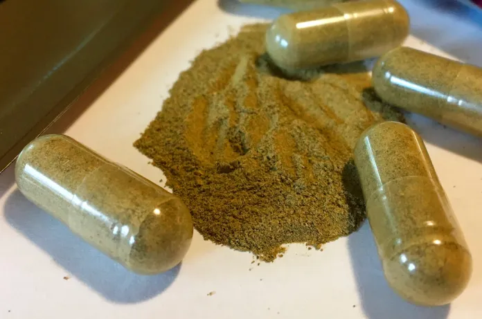 Kratom capsules on a table.
