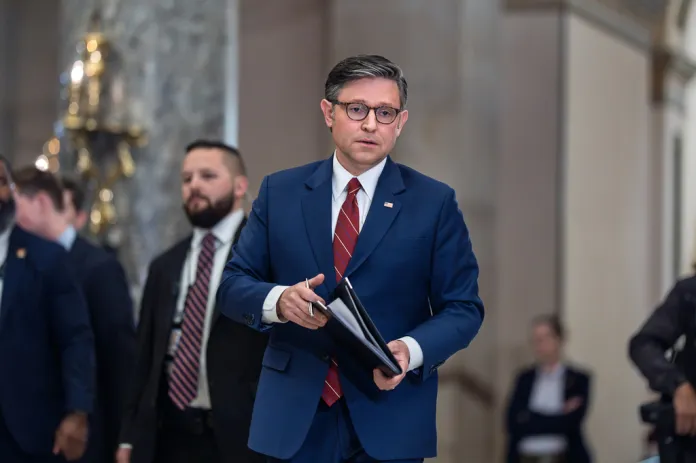 Speaker of the House Mike Johnson, R-La., walks from the chamber to speak with reporters after the final vote to bring the longest government shutdown in history to an end, at the Capitol in Washington, Wednesday, Nov. 12, 2025.