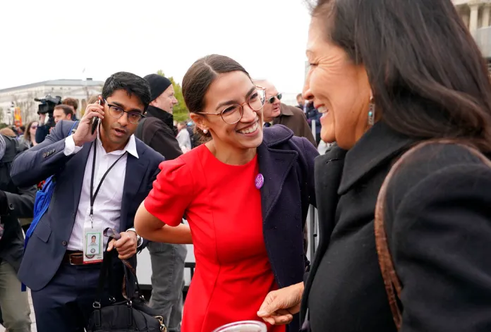 Rep.-elect Alexandria Ocasio-Cortez, D-NY. talks with Rep.-elect Deb Haaland.