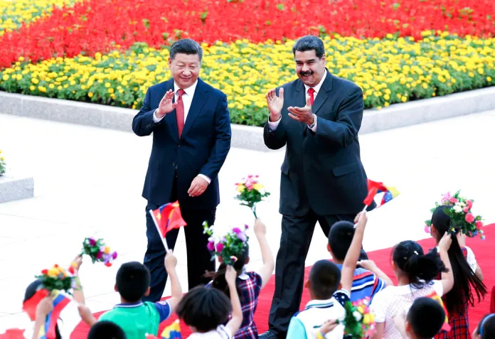 Maduro walks with Xi Jinping in Beijing