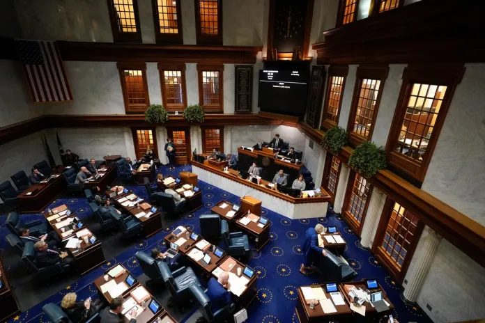 Senators meet in the Senate chamber at the Statehouse