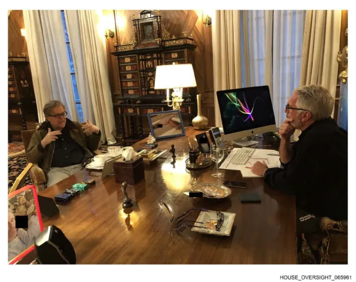 Sitting behind a desk, Jeffrey Epstein talks with Steve Bannon. (Shared by House Oversight Committee Democrats)