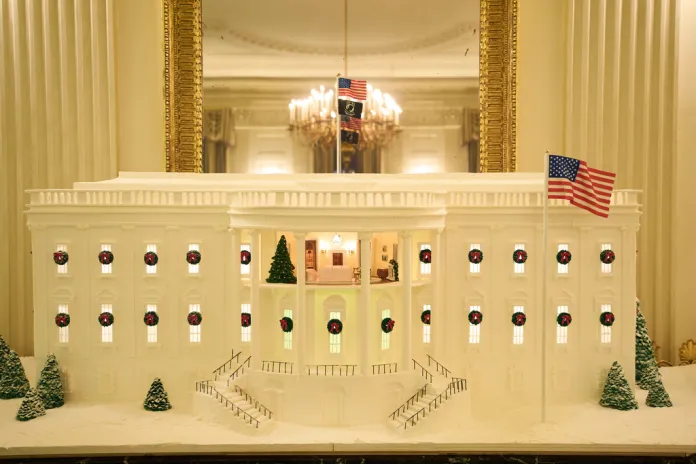 A gingerbread house decorates the State Dining Room of the White House.