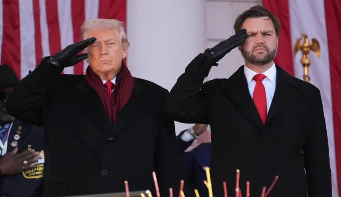 President Donald Trump and Vice President JD Vance salute before speaking during an event to mark Veterans Day.