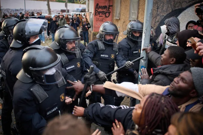 Migrants confront police in Spain.