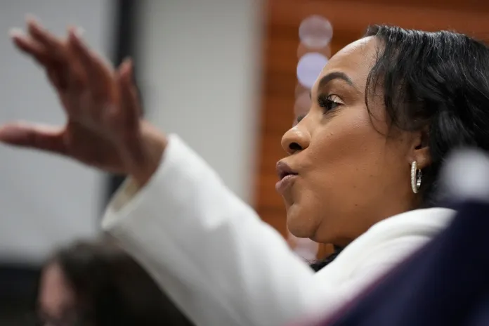 Fulton County District Attorney Fani Willis is seen at the Georgia State Capitol during questioning from a Georgia State Senate panel about her prosecution of President Donald Trump on Wednesday, Dec. 17, 2025, in Atlanta. (AP Photo/Brynn Anderson)