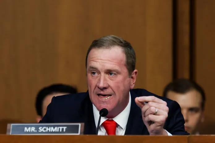Sen. Eric Schmitt (R-MO) speaks into a microphone.