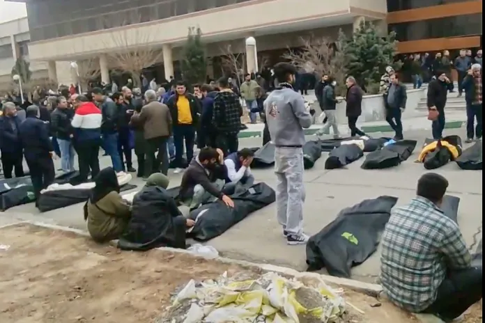 Images from Iran purport to show bodies lined up outside a morgue in Tehran province