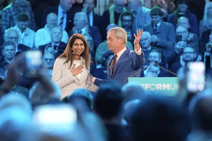 Suella Braverman joins Nigel Farage on-stage at a Veterans for Reform Rally