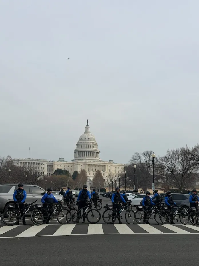 Capitol&nbsp;police line up outside of the U.S Capitol building as January 6 defendants and families peacefully approach. (Sydney Topf/Washington Examiner)