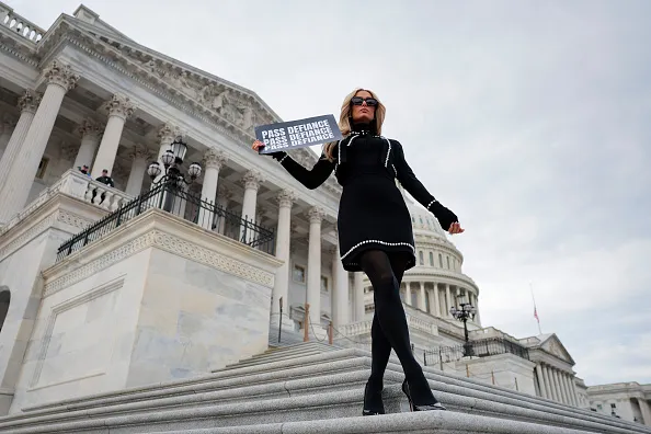 Paris Hilton poses at the Capitol after a press conference in support of the DEFIANCE Act.
