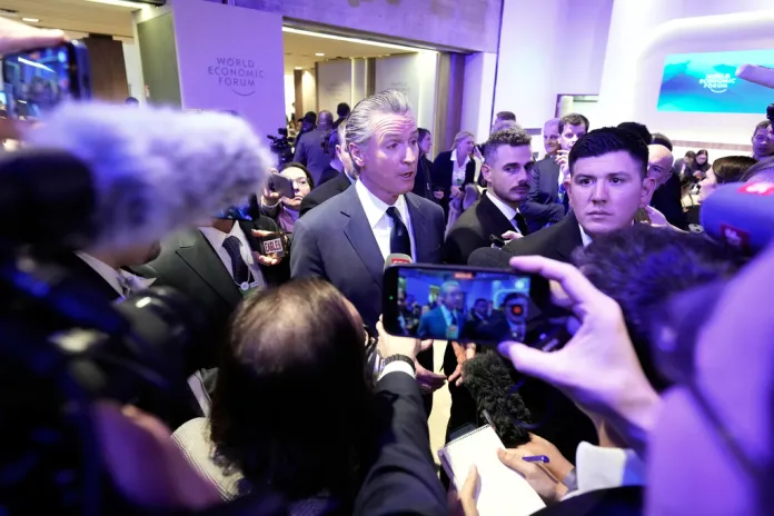 Gov. Gavin Newsom, (D-CA), talks to the media after the speech of President Donald Trump during the Annual Meeting of the World Economic Forum in Davos, Switzerland, Wednesday, Jan. 21, 2026. (AP Photo/Markus Schreiber)