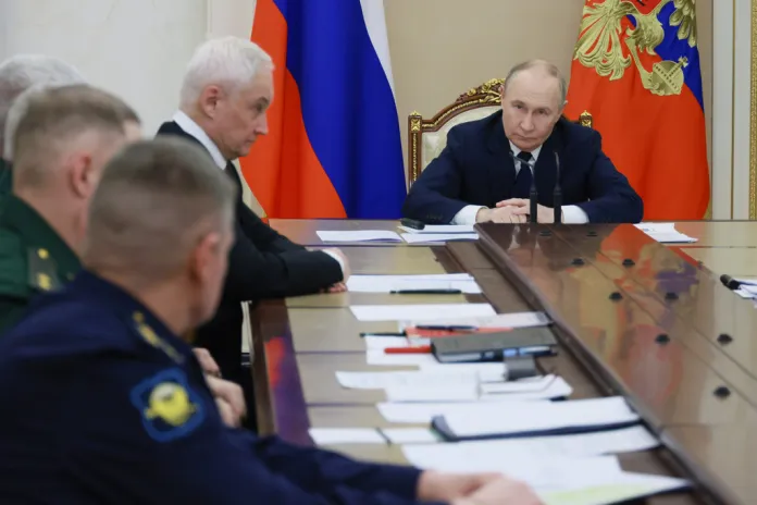 Vladimir Putin meets with defense officials in the Kremlin