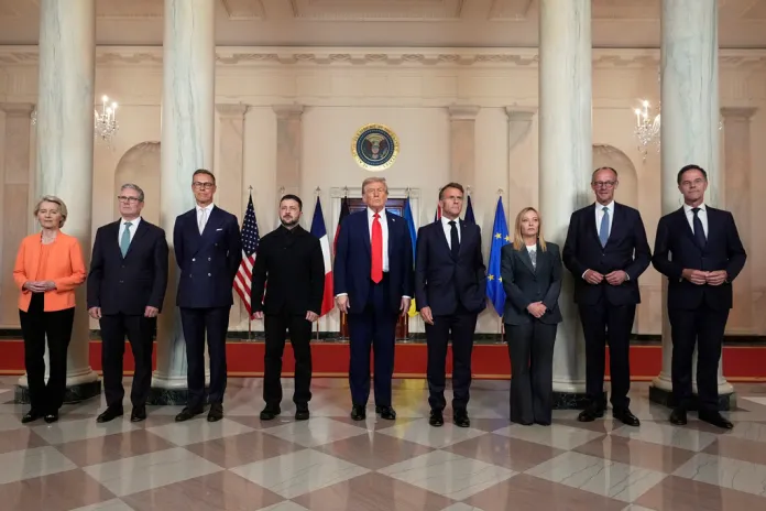 Trump poses with fellow leaders of NATO member nations and Ukrainian President Volodymyr Zelensky