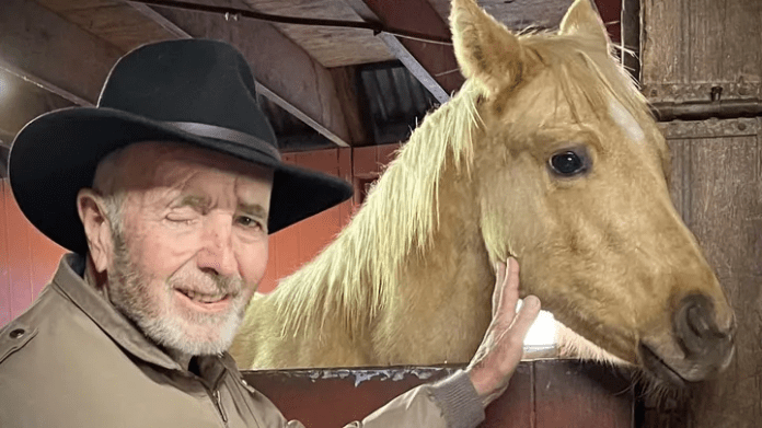 Curtis Lind with a horse.