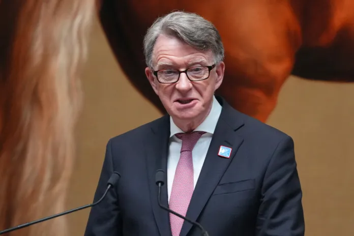 Peter Mandelson speaks from a podium at a gathering in London