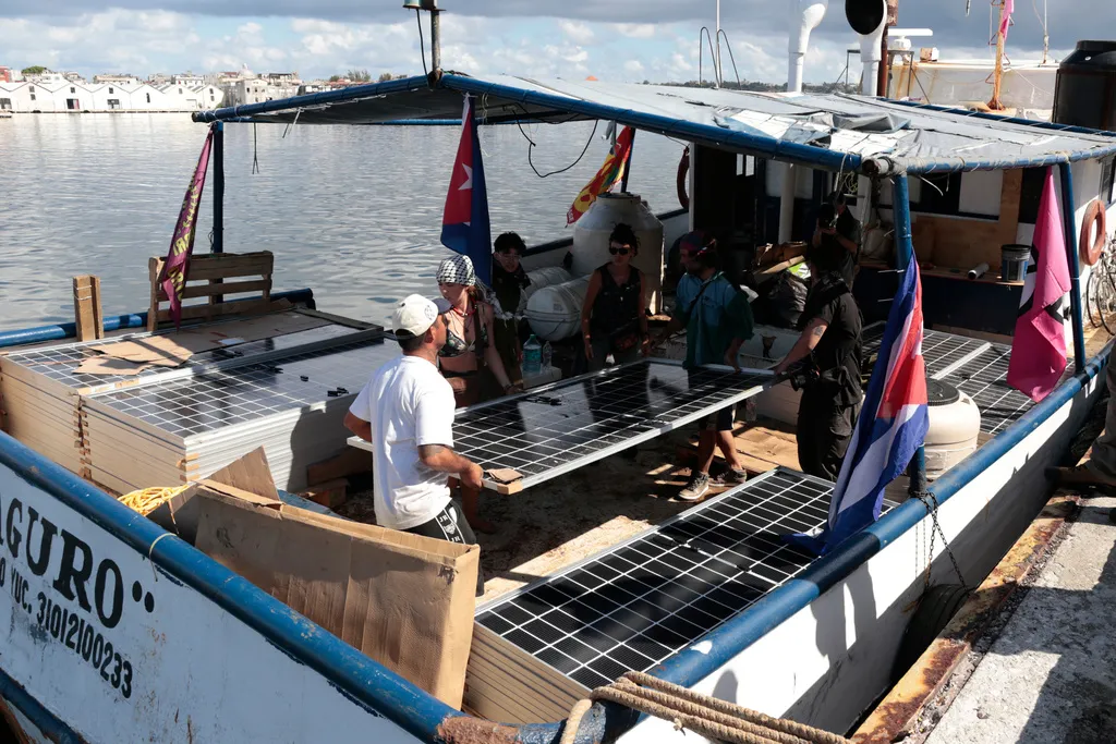 Activists from the vessel Maguro, that arrived from Mexico, unload solar panels and other humanitarian aid from the "Nuestra America," or Our America convoy, at the port in Havana Bay, Cuba, Tuesday, March 24, 2026. 