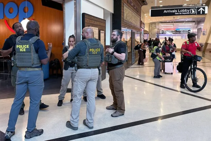 Federal immigration agents at Hartsfield-Jackson Atlanta International Airport.