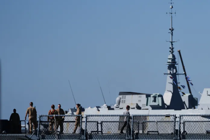 French sailors are seen aboard a navy frigate.