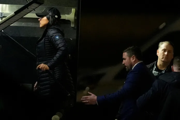 Director of National Intelligence Tulsi Gabbard, left, and FBI Deputy Director Andrew Bailey, enter a command vehicle