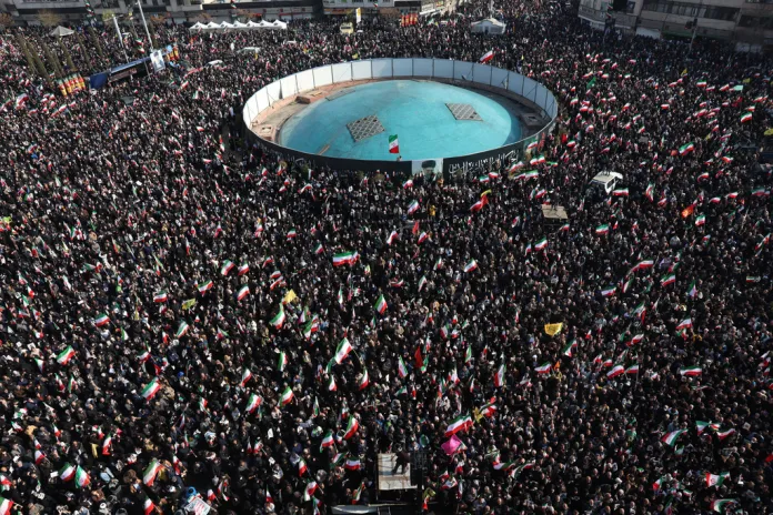 People gather at a rally to support Iranian Ayatollah Mojtaba Khamenei.