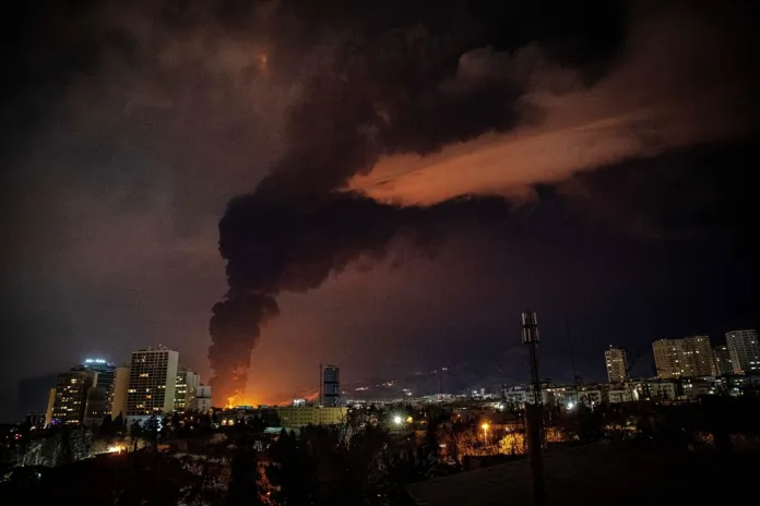 Flames and smoke rise from an oil storage facility in Tehran, Iran, on March 7, 2026.