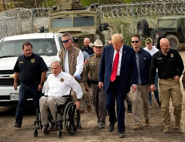 Republican presidential candidate former President Donald Trump walks during a visit to Shelby Park on the U.S.-Mexico border, Thursday, Feb. 29, 2024, in Eagle Pass, Texas. At left is Mike Banks, special adviser to the governor on border matters, and Texas Gov. Greg Abbott, second from left. (AP Photo/Eric Gay)