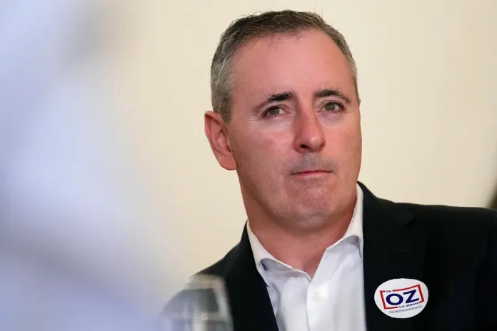 Rep. Brian Fitzpatrick, R-Pa., listens during a campaign event for Mehmet Oz, a Republican candidate for U.S. Senate in Pennsylvania, in Washington Crossing, Pa., Sunday, Nov. 6, 2022.