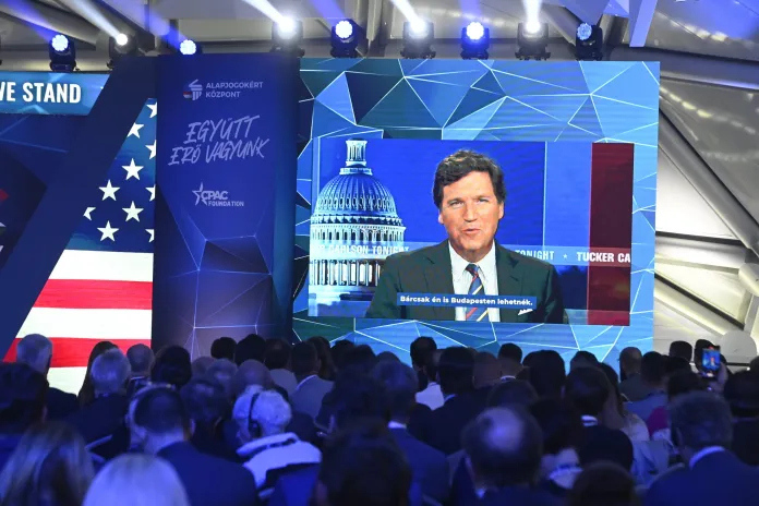 American media personality Tucker Carlson appears on the screen during the opening session of Hungary Conservative Political Action Conference Hungary in Budapest, Hungary, Thursday, May 4, 2023. The two-day CPAC meeting organized by Center for Fundamental Rights of Hungary features some 60 prestigious foreign speakers from 20 countries and five continents.
