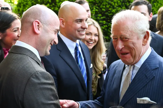 Britain's King Charles III talks with White House Deputy Chief of Staff Stephen Miller during a garden party at the British Embassy, Monday, April 27, 2026, in Washington. 