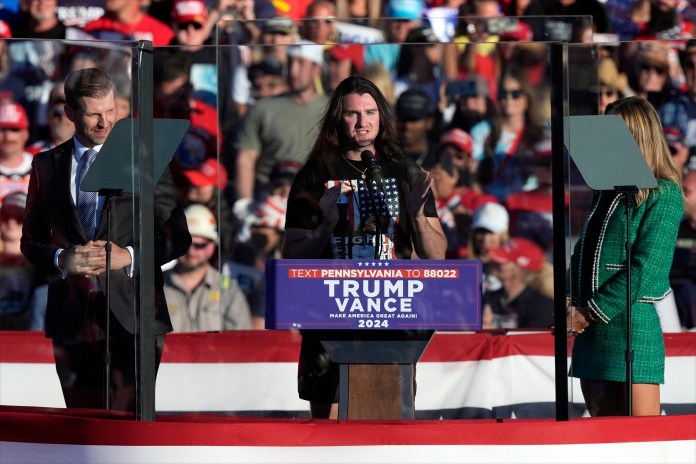 Scott Presler speaks as Eric Trump and Republican National Committee co-chair Lara Trump listen at a campaign rally for Republican presidential nominee former President Donald Trump at the Butler Farm Show, Saturday, Oct. 5, 2024, in Butler, Pa. (AP Photo/Julia Demaree Nikhinson)