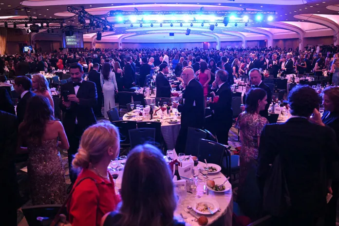 Attendees are seen inside the ballroom after shots were reportedly fired during the White House Correspondents' dinner at the Washington Hilton in Washington, DC, on April 25, 2026. Shots were allegedly fired as US President Donald Trump attended a press dinner in Washington on Saturday night, witnesses and AFP reporters said as loud bangs were heard at the hotel venue. (Photo by Mandel NGAN / AFP via Getty Images)