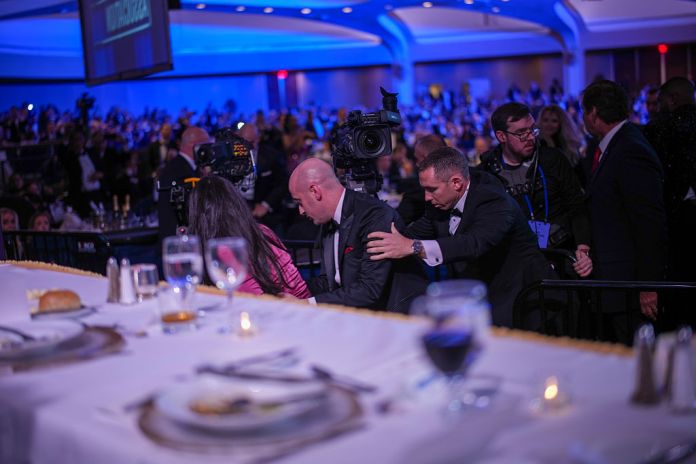 WASHINGTON, DC - APRIL 25: Katie Miller and Stephen Miller are escorted 1after an incident at the annual White House Correspondents Association Dinner April 25, 2026 in Washington, DC. According to reports, President Donald Trump, along with other government officials, were evacuated from the Washington Hilton after what sounded like gun fire. (Photo by Andrew Harnik/Gettyimages)