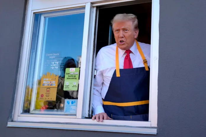 Trump speaks through a McDonalds drive through window.