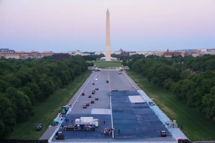 President Donald Trump visits the reflecting pool as it undergoes a repaint