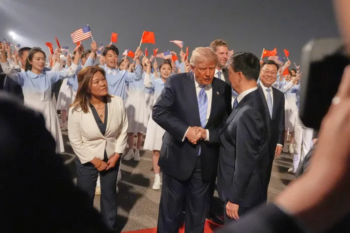 President Donald Trump shakes hands during a welcome ceremony Wednesday, May 13, 2026, at Beijing Capital International Airport in Beijing. (AP Photo/Mark Schiefelbein)