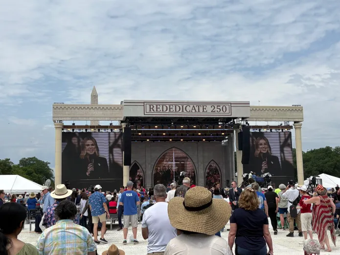 Podcaster Sadie Robertson Huff speaking at Rededicate 250 on the National Mall.